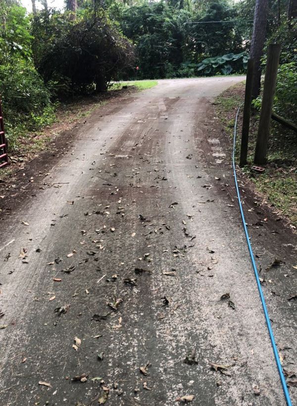 A stained driveway before cleaning